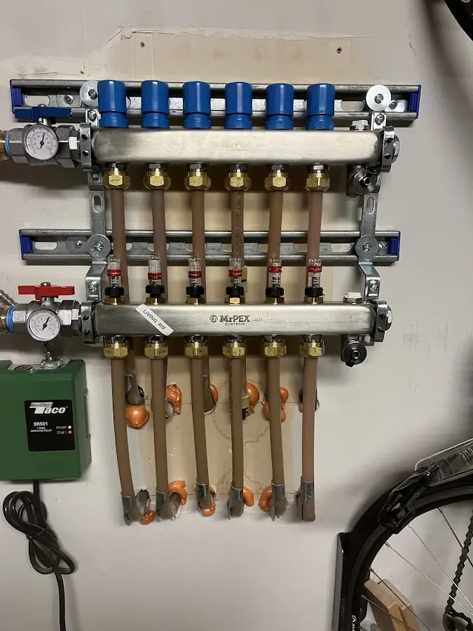 Plumber performing Water Heater Repair at a residential property in East Bethel